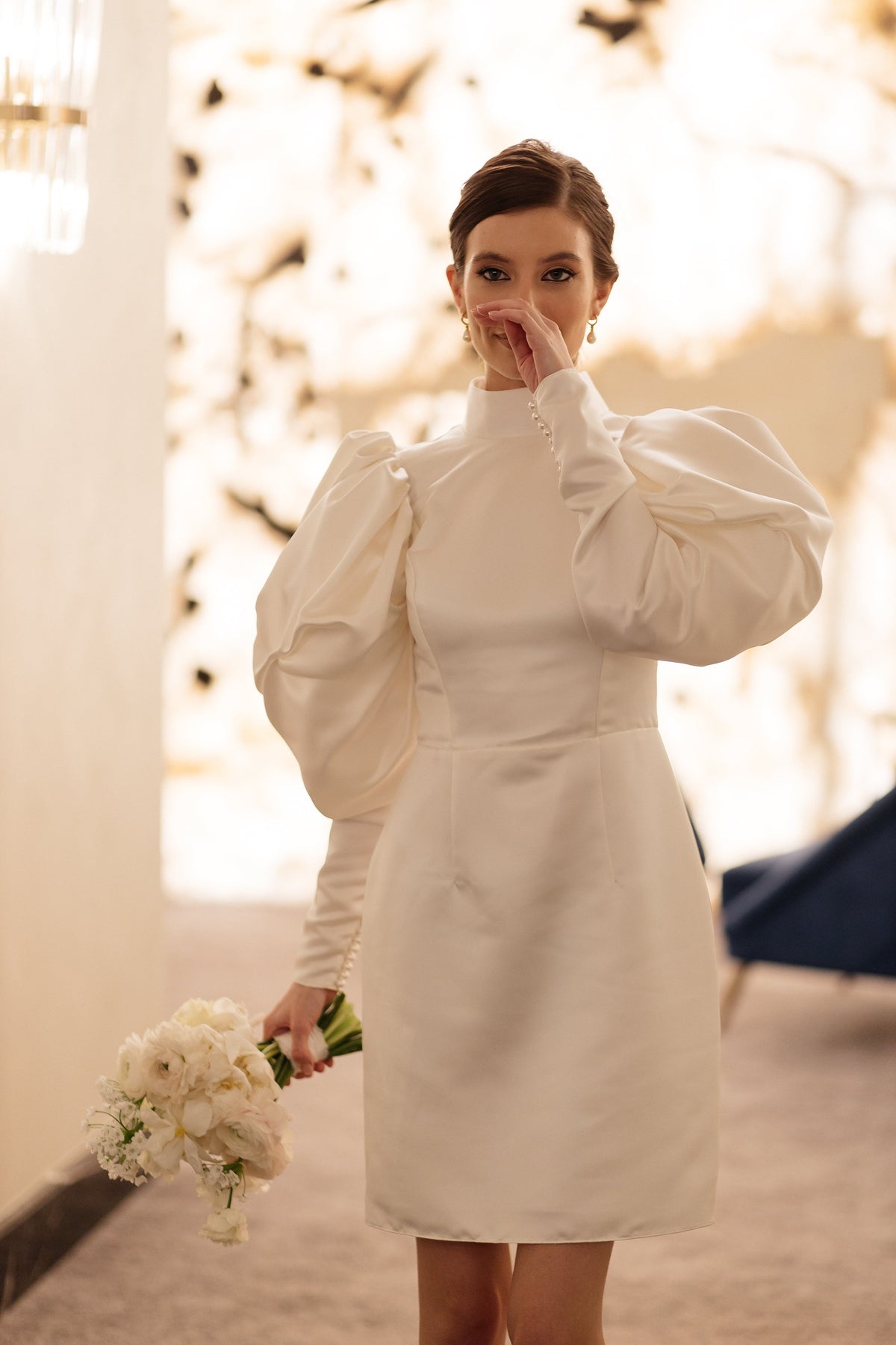 Ivory matte satin mini wedding dress with puff sleeves, front view