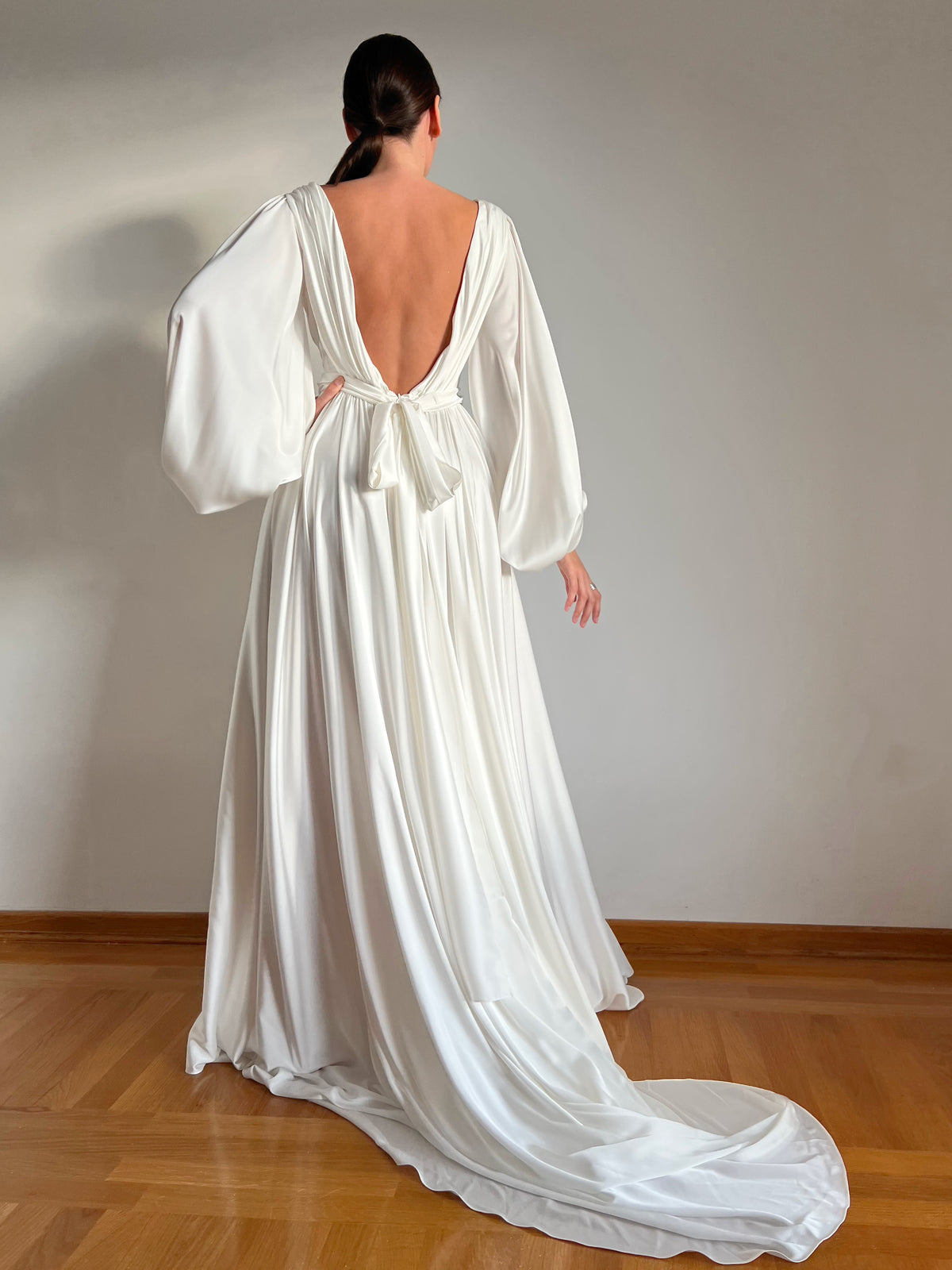 Artificial silk wedding dress with long train, full length view