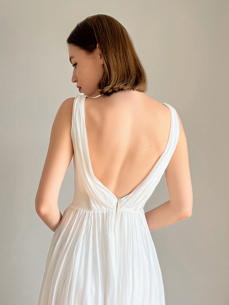 Back view of the chiffon slit-skirt wedding dress showing the open back.