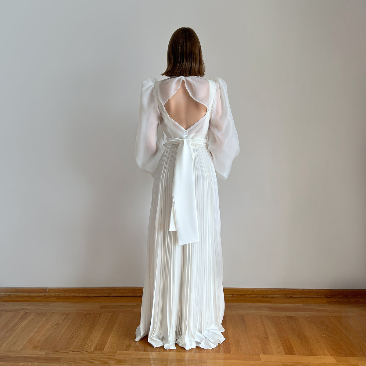 Ivory pleated wedding dress with organza blouse