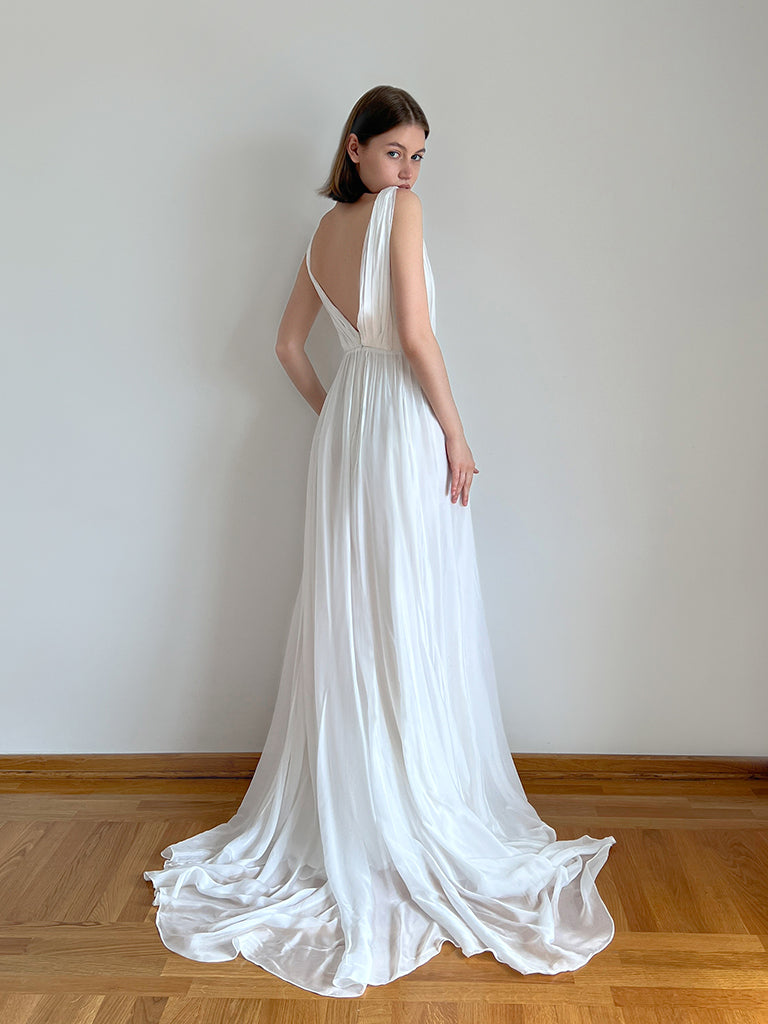 Full-length view of the chiffon wedding dress showing its classic silhouette.