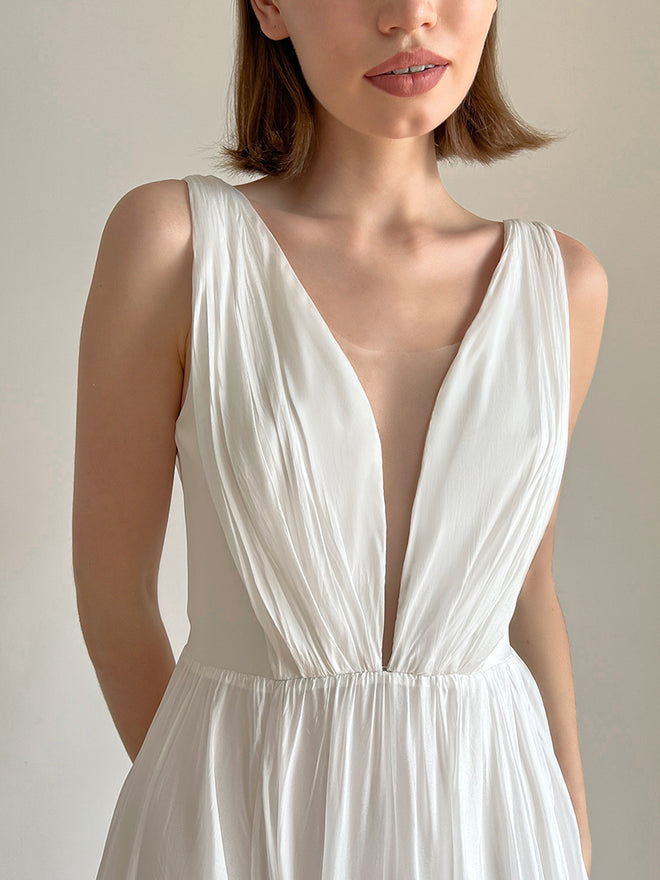 Close-up of the flowing chiffon fabric on the slit-skirt wedding dress.